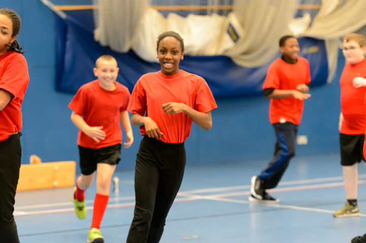 School children running indoors