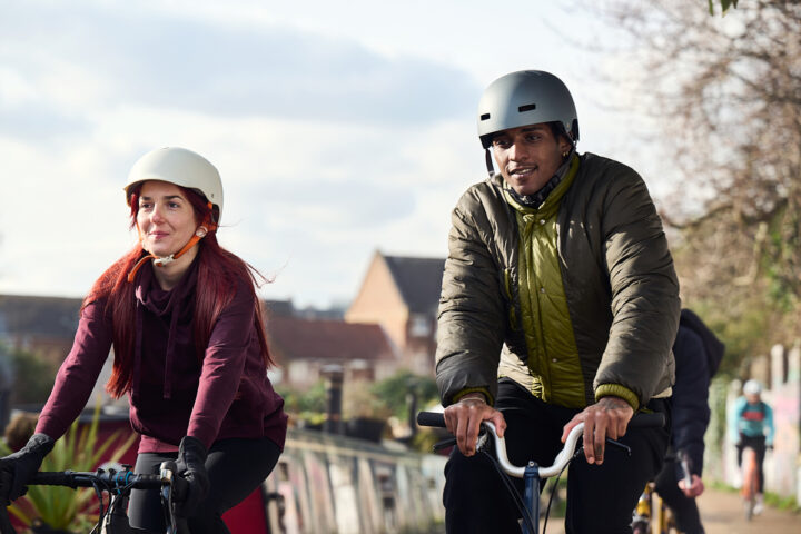 Two people riding bicycles. Image credit: Sport England.