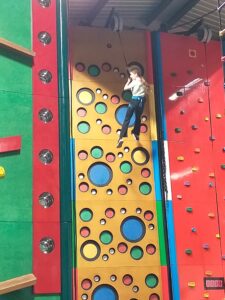 Child playing clip and climb.