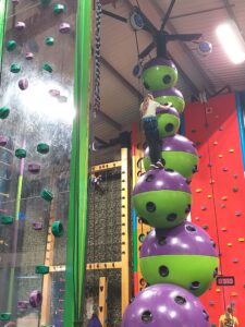 Child playing clip and climb.