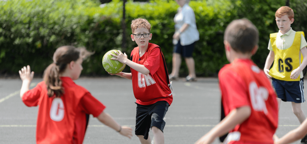 Photo by Sport England. Children playing netball