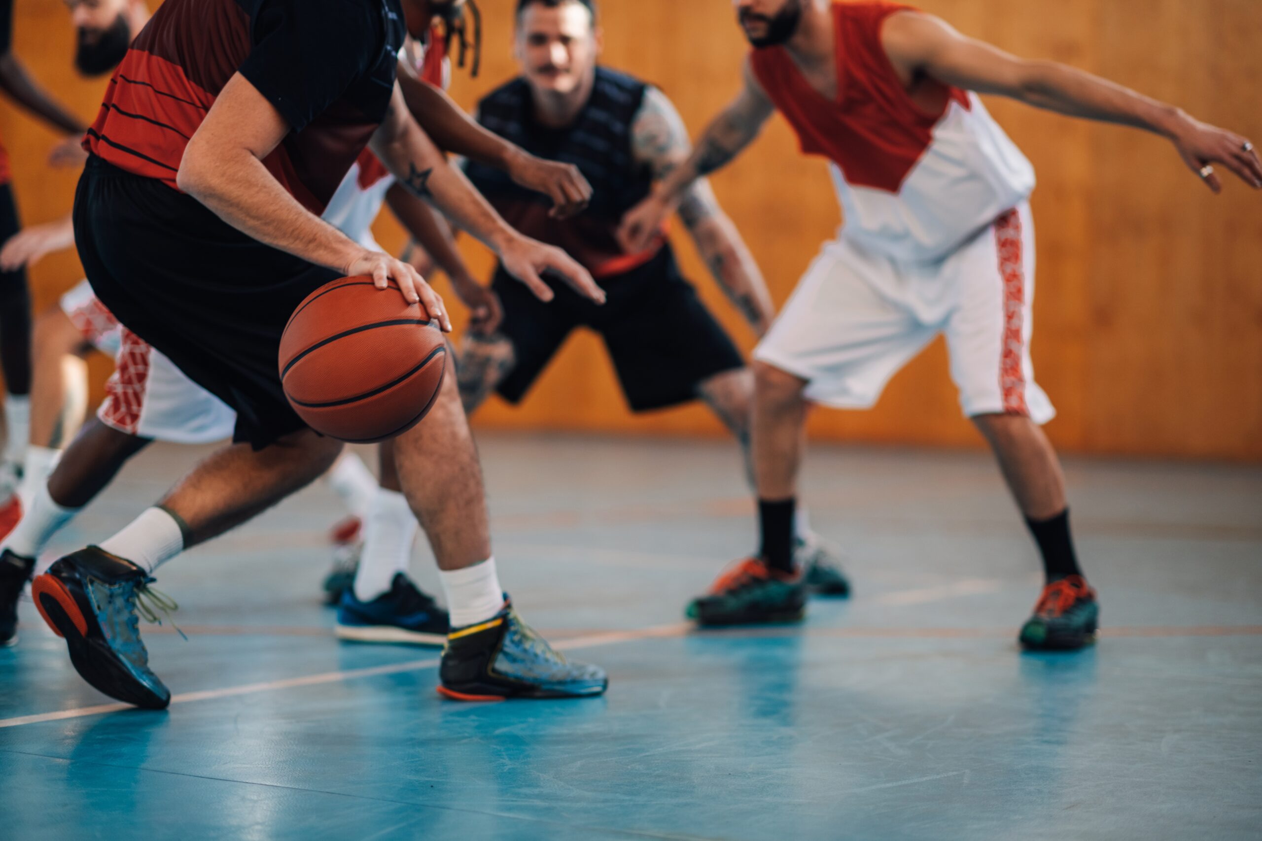 Diverse group playing basketball.